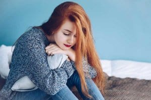 Opiate addiction making this red-headed young woman depressed