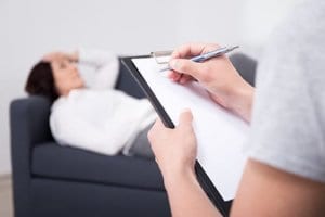 Therapist working with client on EMDR therapy.