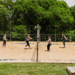 Clients playing on Volleyball court at Santé Center for Healing