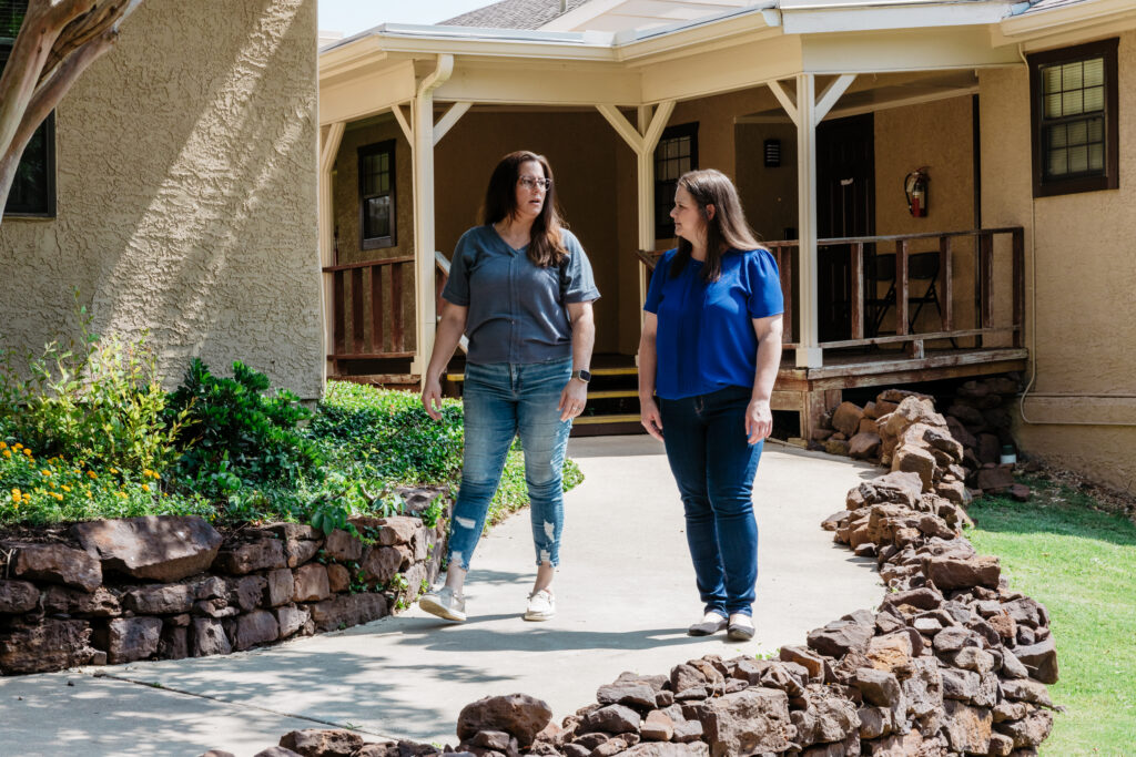 Clients walking outside the residential buildings