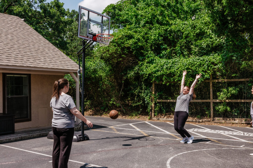 Clients playing basketball