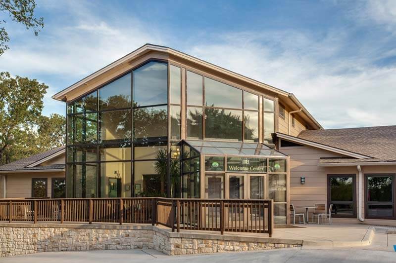 Glass front of Welcome Center in the morning.
