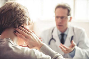 A doctor talks to a woman about addiction treatment for medical professionals