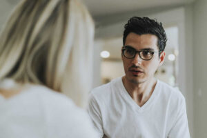 a man and a woman discussing a Vyvanse Addiction Treatment Center