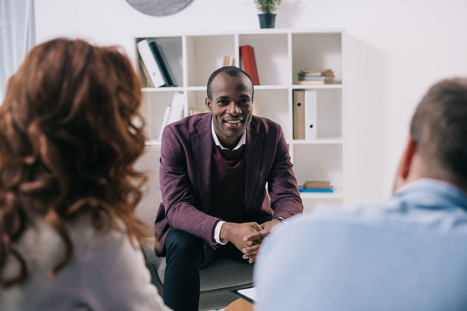 a man shares in group therapy during alumni programming