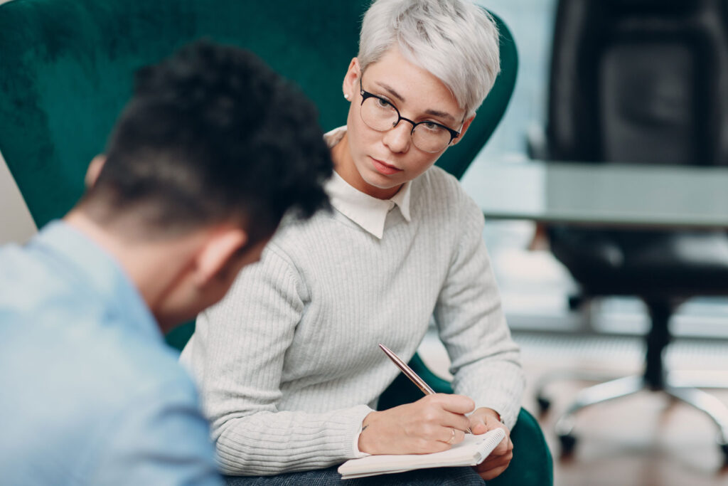 therapist talking to client about bipolar disorder treatment