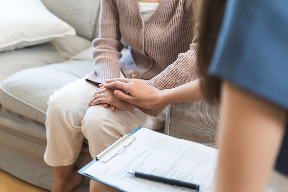 A therapist guides her client through mediation and mindfulness practices as part of a holistic approach to treatment.