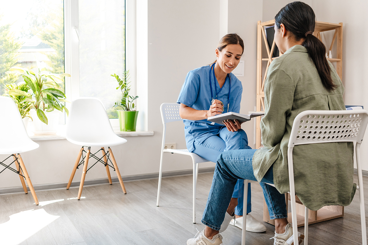 A client speaks with a team member at Santé and learns about the medication assisted treatment program (MAT).