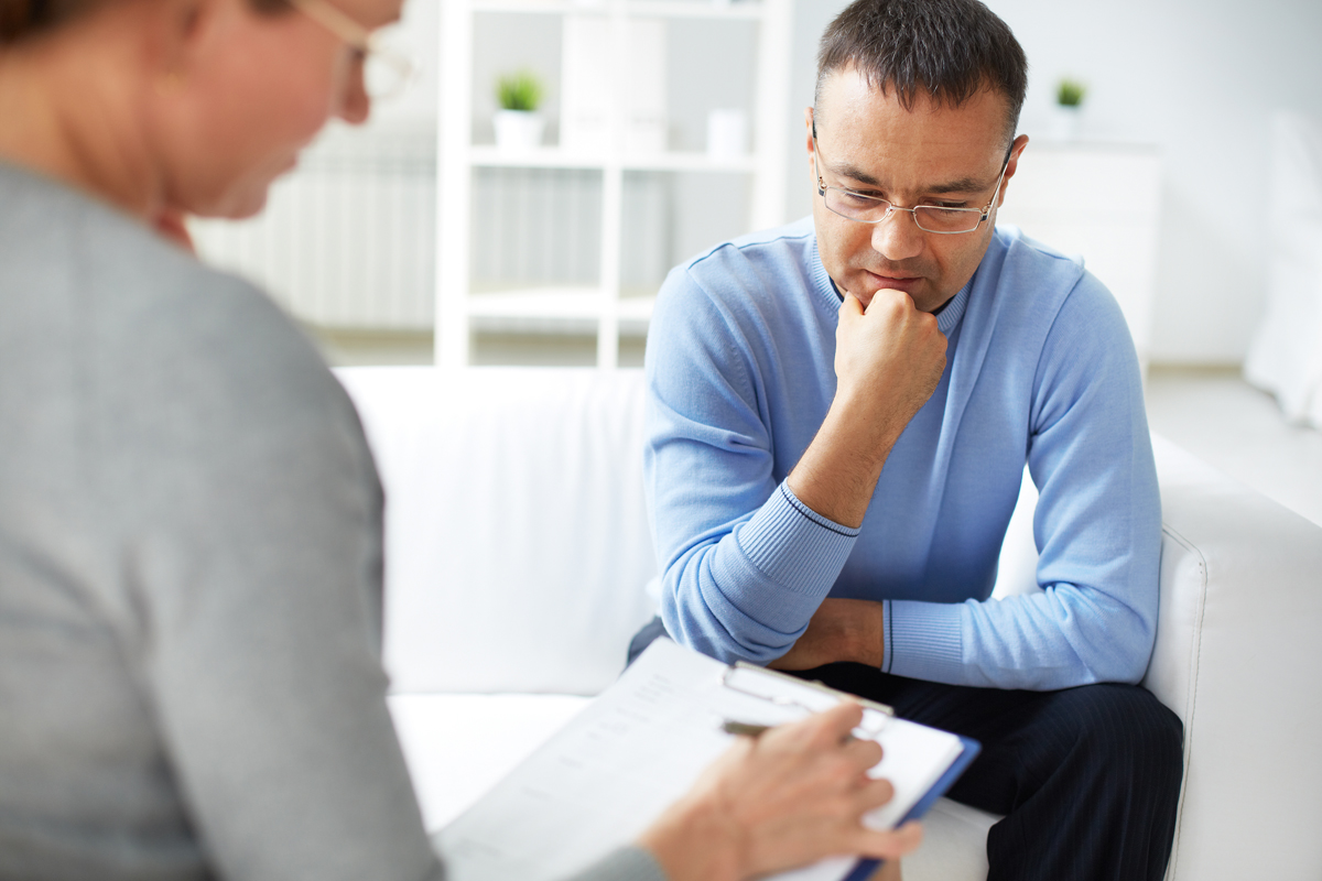 Man lost in thought at counseling session